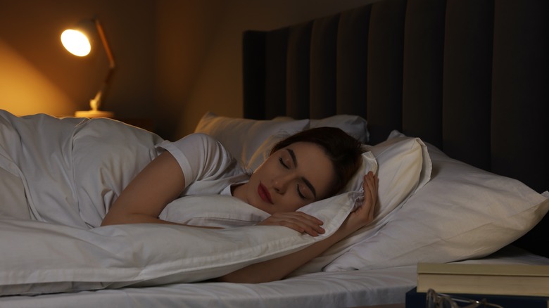 woman sleeping with night light