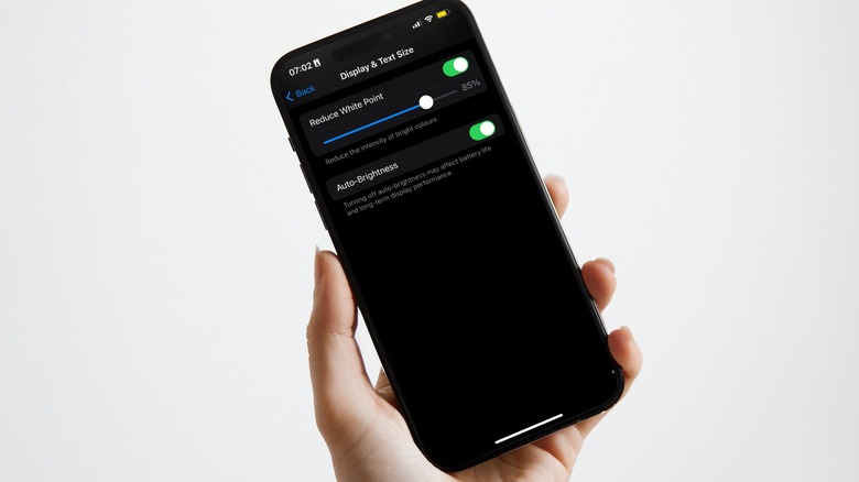 iPhone with accessibility settings on screen
