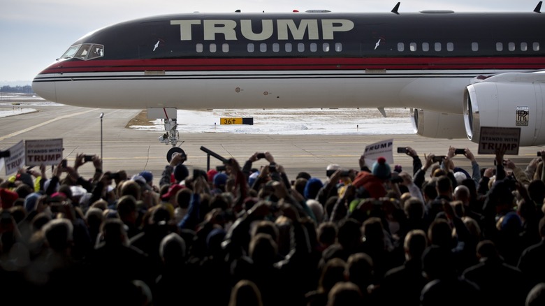 Trump's jet with a rally crowd near it