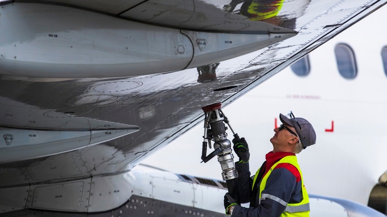 Person fueling an aircraft