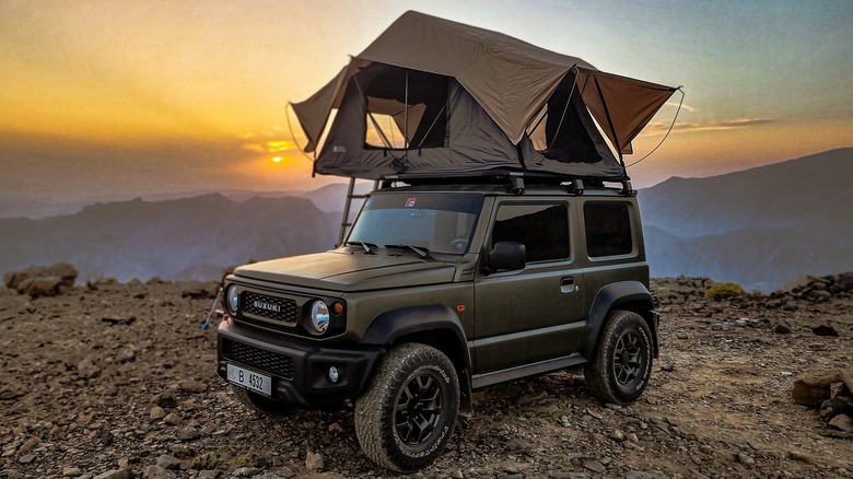 Couple in a rooftop tent