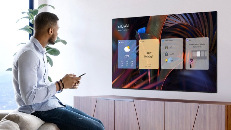 Person using a Samsung flat TV